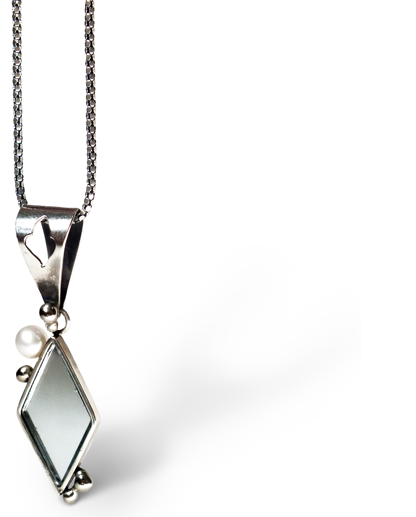 Handcrafted silver and mirror jewelry reflecting life's quiet beauties